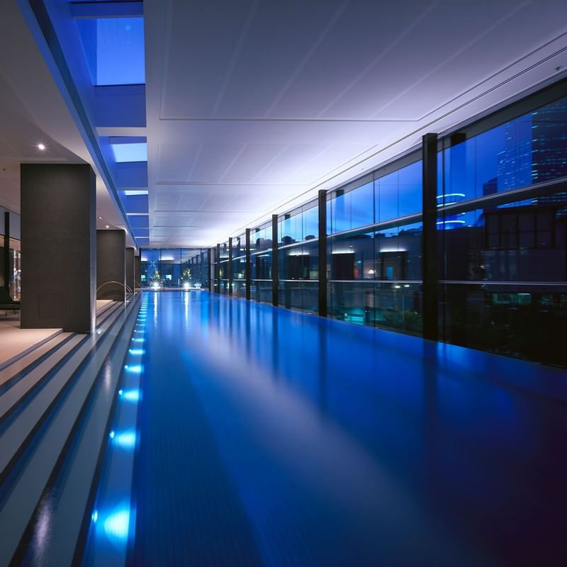 Indoor pool with sunbeds at Crown Promenade Melbourne