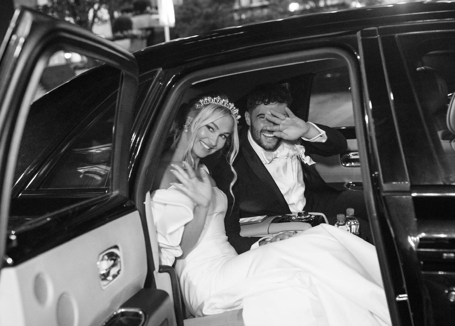 Couple going away moment in car at The Mayo Hotel