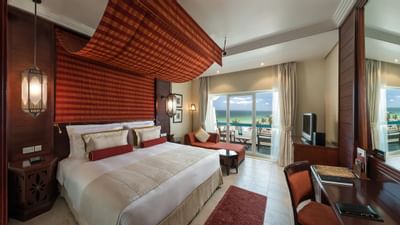 Large bed, King deluxe room with sea view at Hotel Ajman