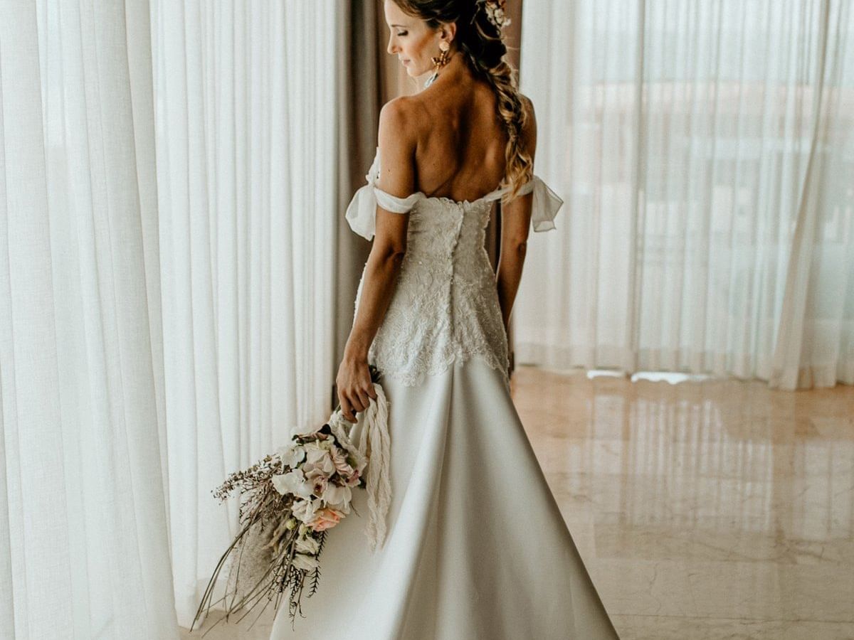 Bride holding the flower
at the La Coleccion Resorts