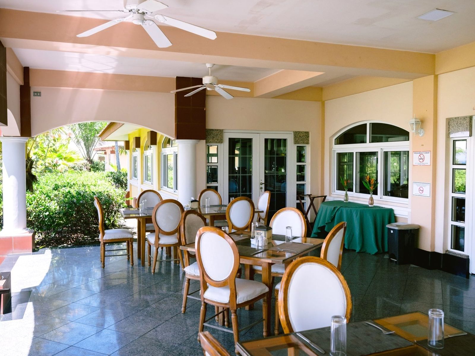 La Abigail Restaurant Terrace with dining tables at Las Olas Beach Resort