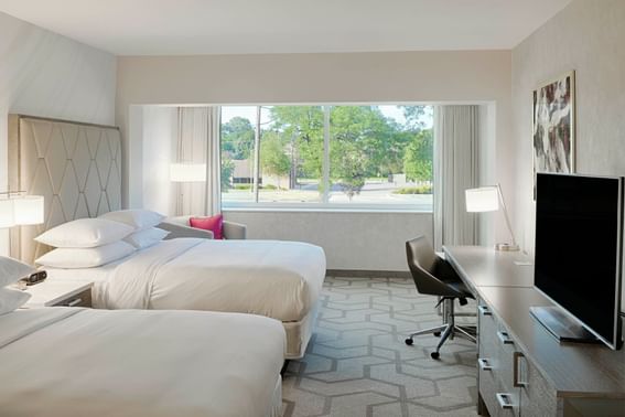 Two queen beds in bedroom at the Kingsley Bloomfield Hills