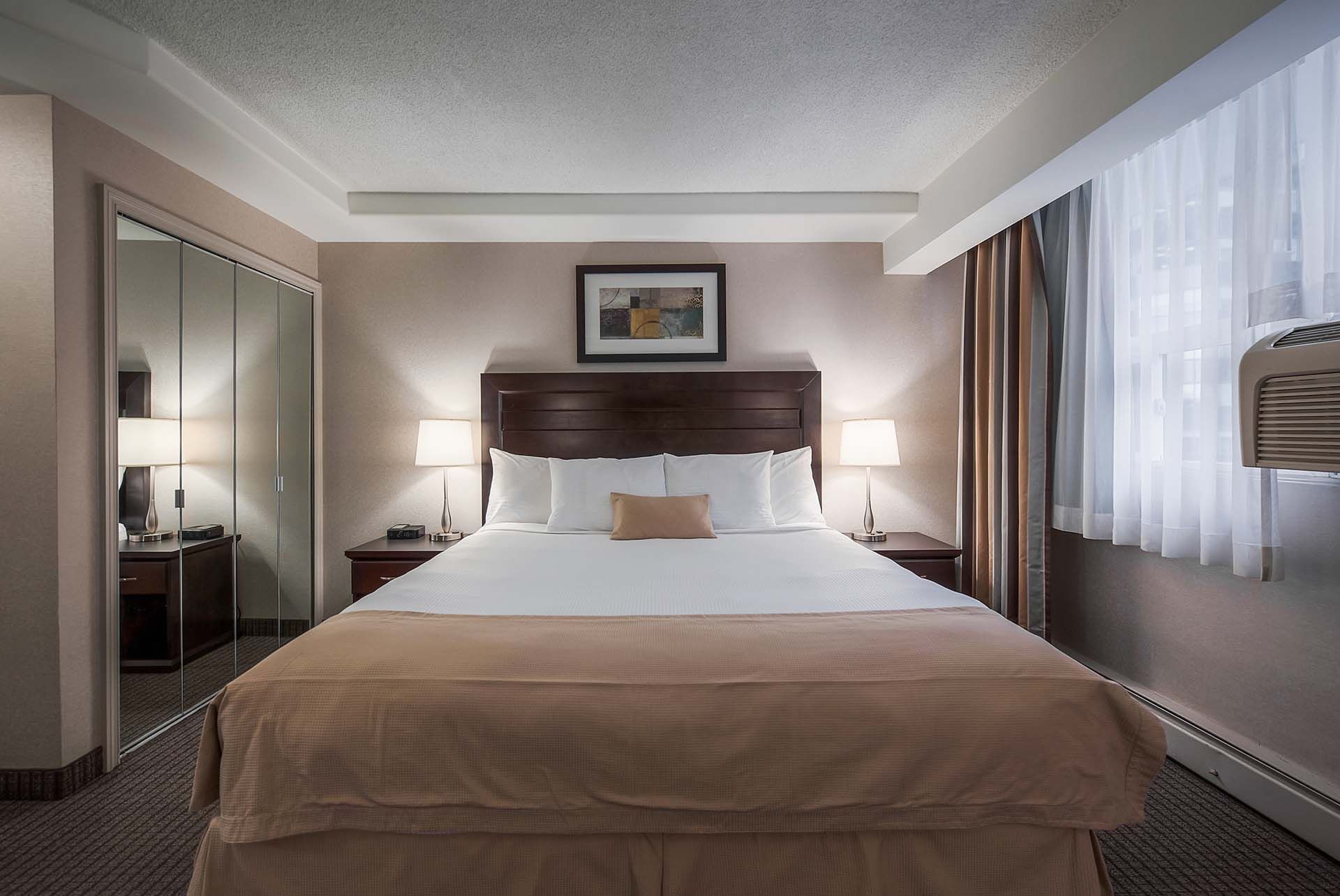 Double bed in Suite at Coast Calgary Downtown Hotel