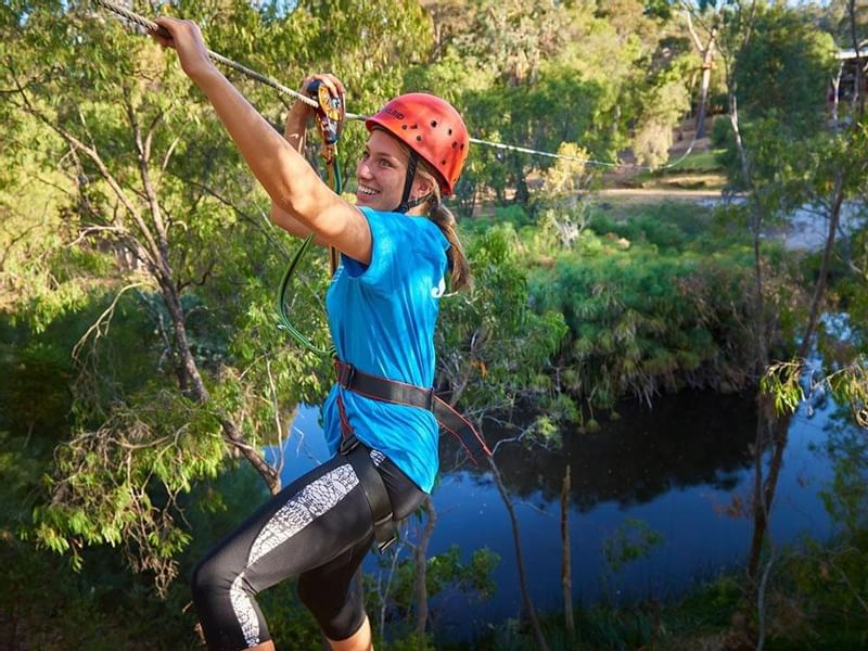 Close up of a girl Zip-lining near Pullman Bunker Bay Resort