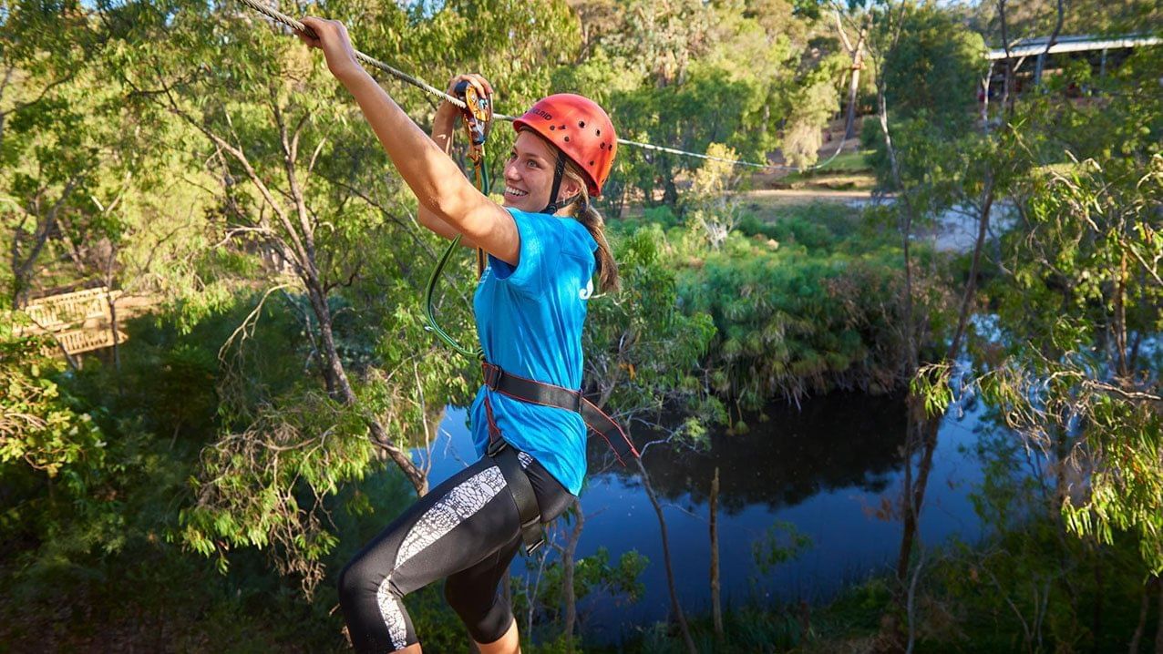 Close up of a girl Zip-lining near Pullman Bunker Bay Resort
