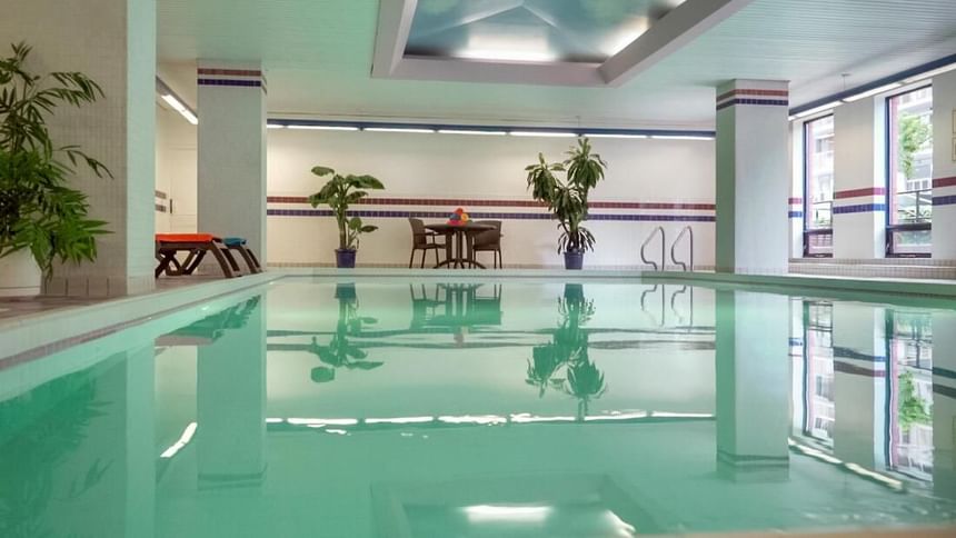 Indoor swimming pool at Cartier Place Suite Hotel