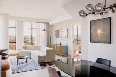 Living room with modern interior & serene view in Presidential Suite at Godfrey Hotel Detroit