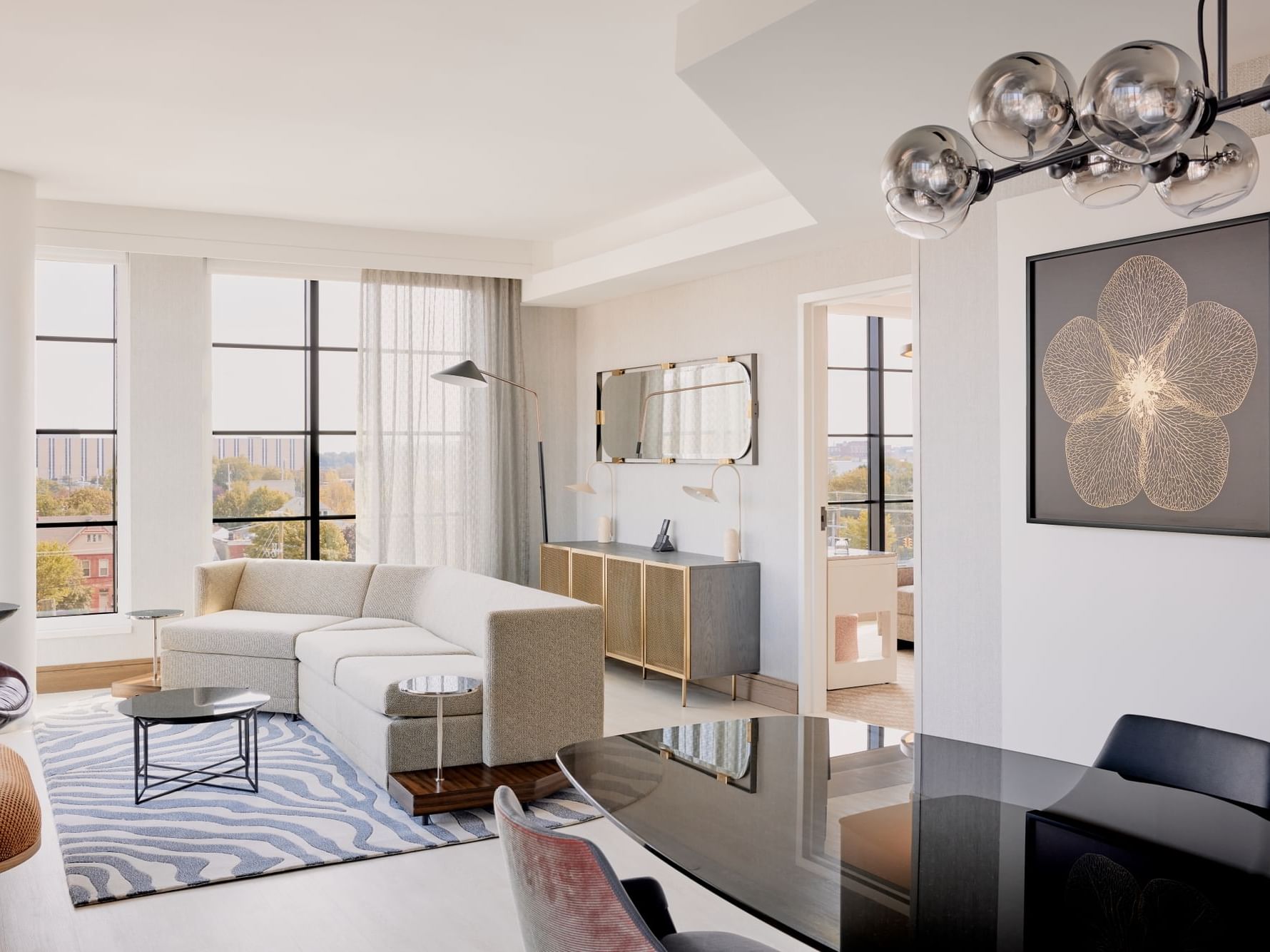 Living room with modern interior & serene view in Presidential Suite at Godfrey Hotel Detroit