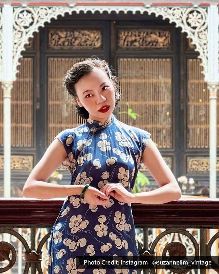 A woman in Chinese dress was making a pose in front of the camera - Lexis Suites Penang
