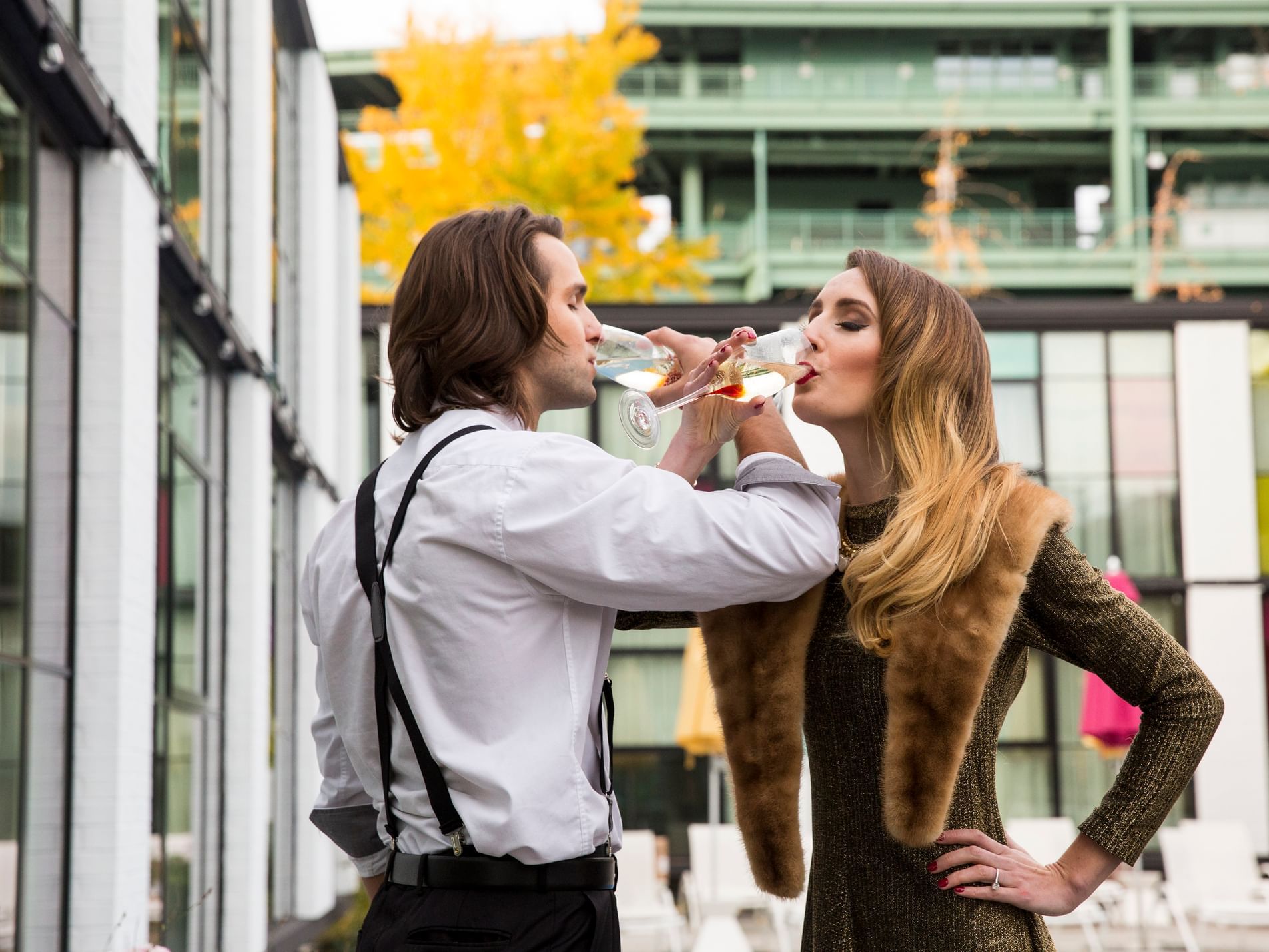 A man and woman drinking champagne together