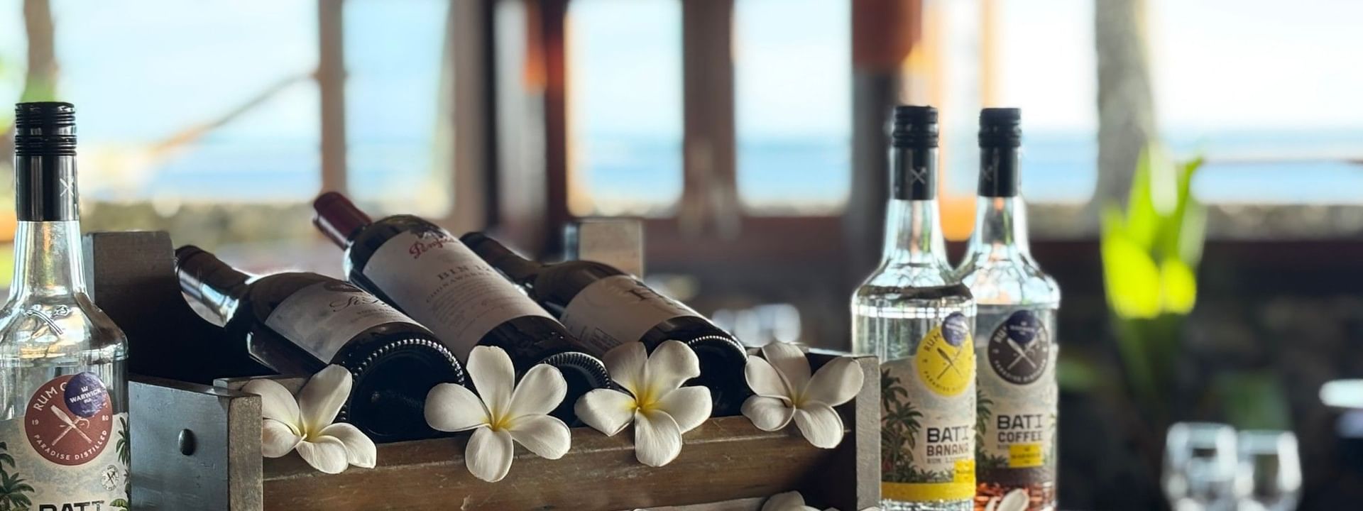 Bottles of alcohol and flowers at Wicked Walu restaurant at Warwick Fiji Resort and Spa in Korolevu
