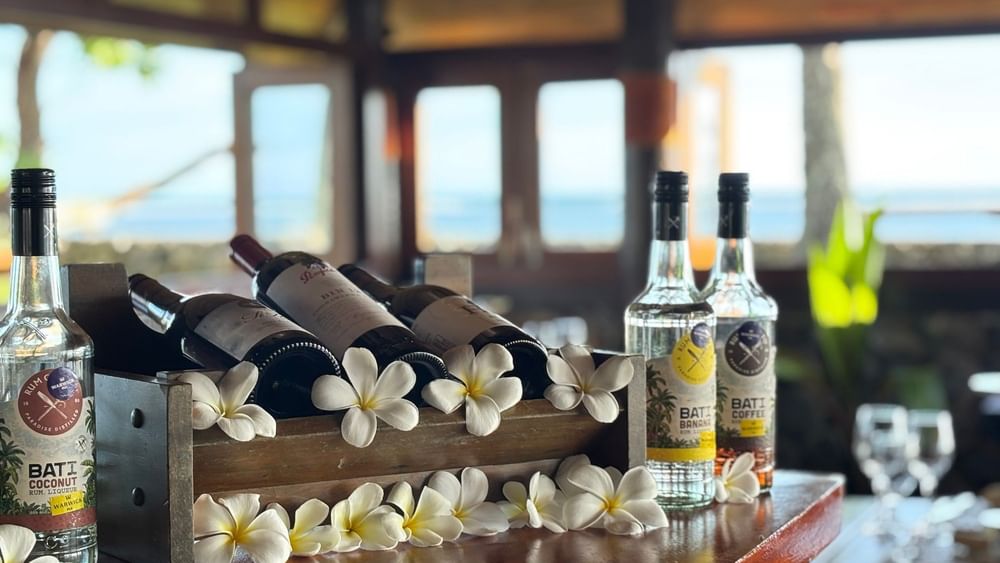 Bottles of alcohol and flowers at Wicked Walu restaurant at Warwick Fiji Resort and Spa in Korolevu.