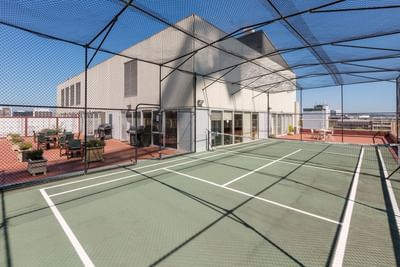 Outdoor tennis court on a sunny day, Nesuto Canberra Apartment