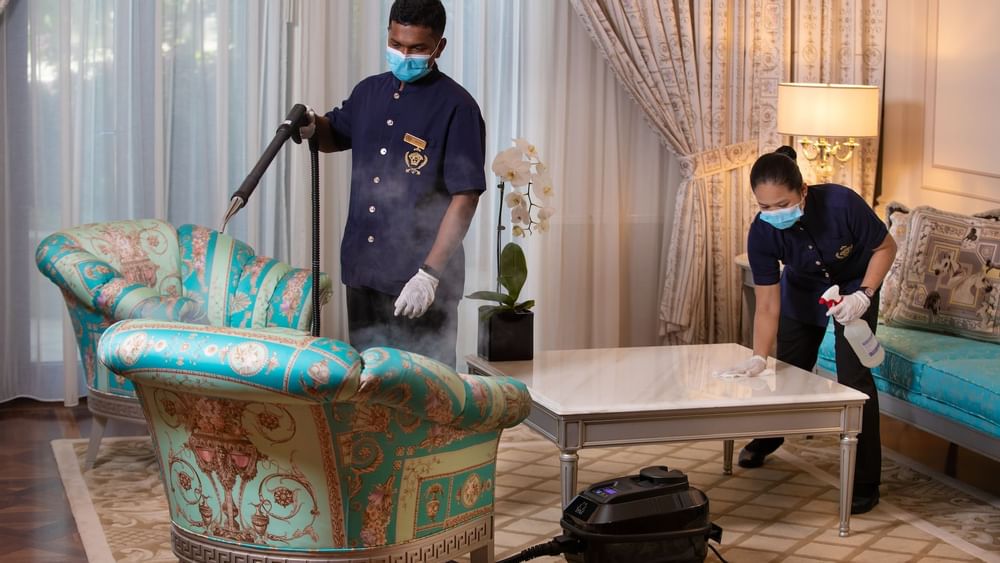 2 staffs spaying disinfectants on furniture at Palazzo Versace 