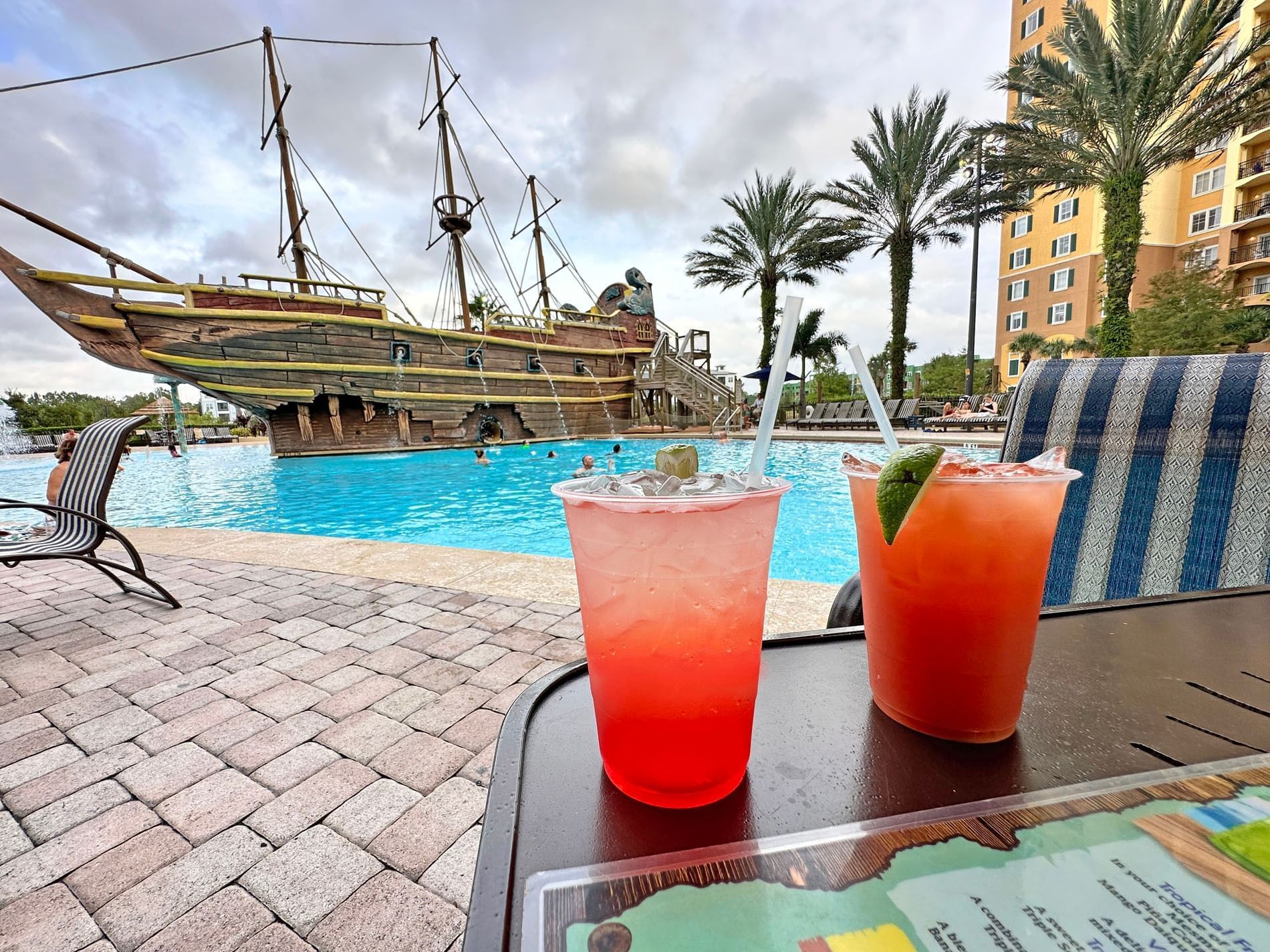 Cocktails served on a table in pool side at Lake Buena Vista Resort Village & Spa