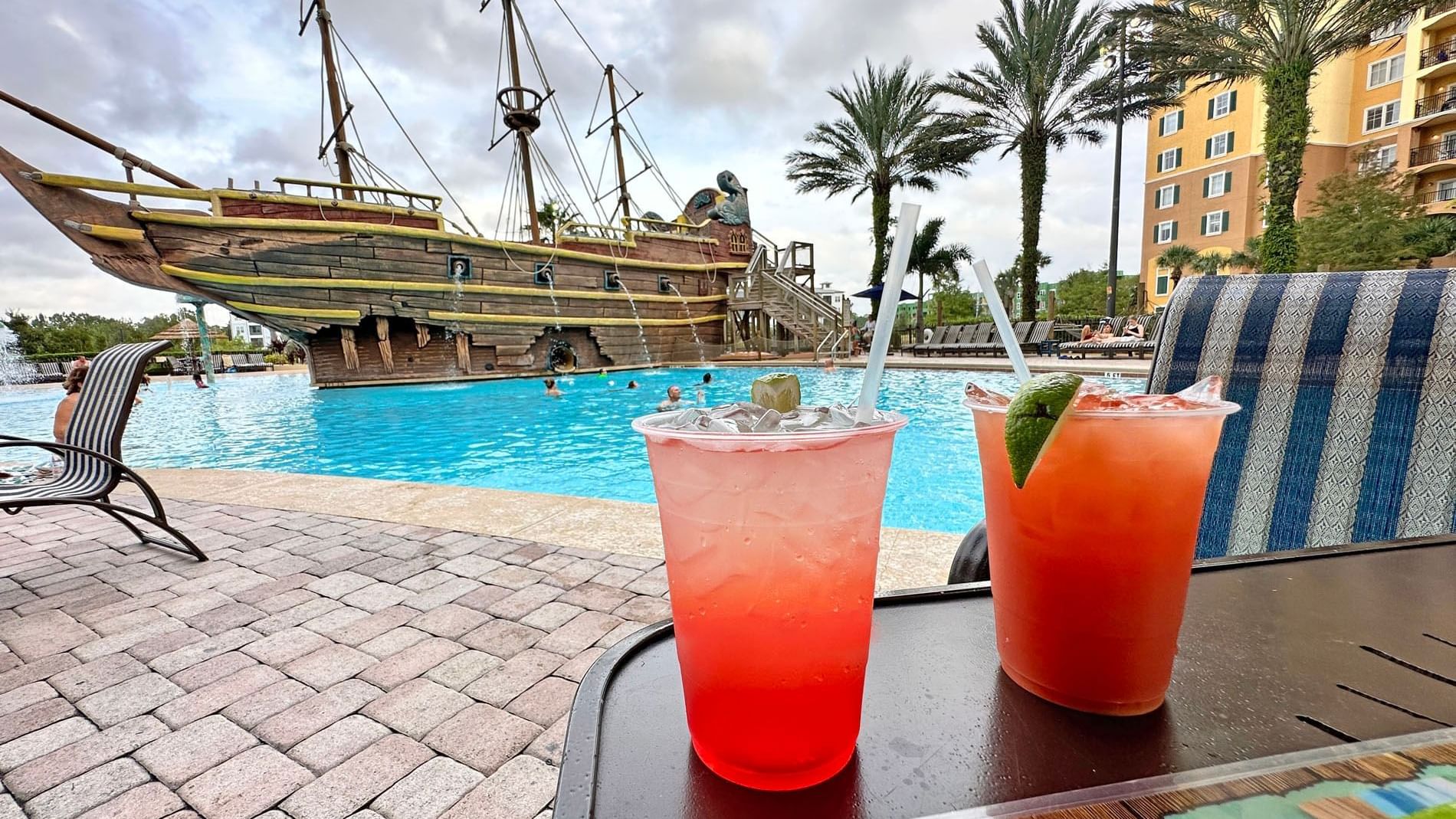 Cocktails served on a table in pool side at Lake Buena Vista Resort Village & Spa