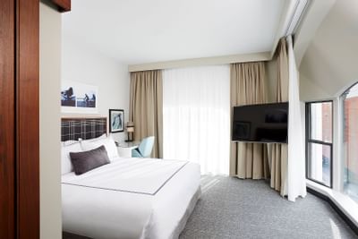 Interior of Corner King Loft with city views at The Godfrey