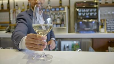 A glass of wine seen in close hand at The Nest Palo Alto