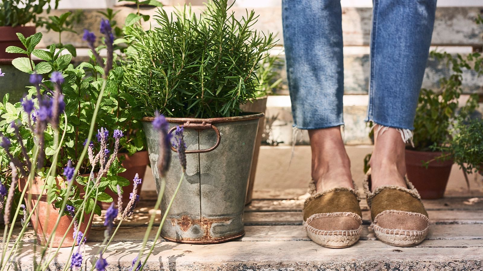 Ground-level shot of a girl & flowerpots at Marbella Club