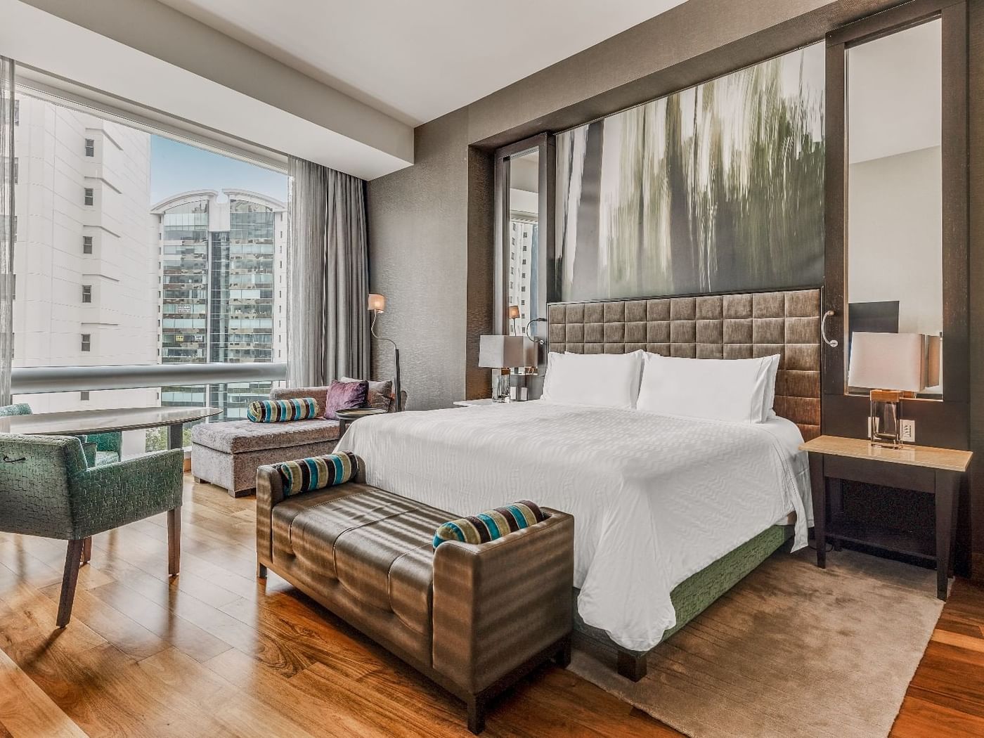Comfy bed with city view in Executive Suite, 1 King at Fiesta Americana Travelty