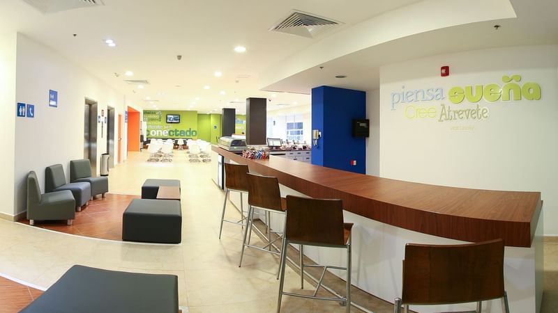Reception Counter & sofas in the lobby at One Xalapa Las Ánimas