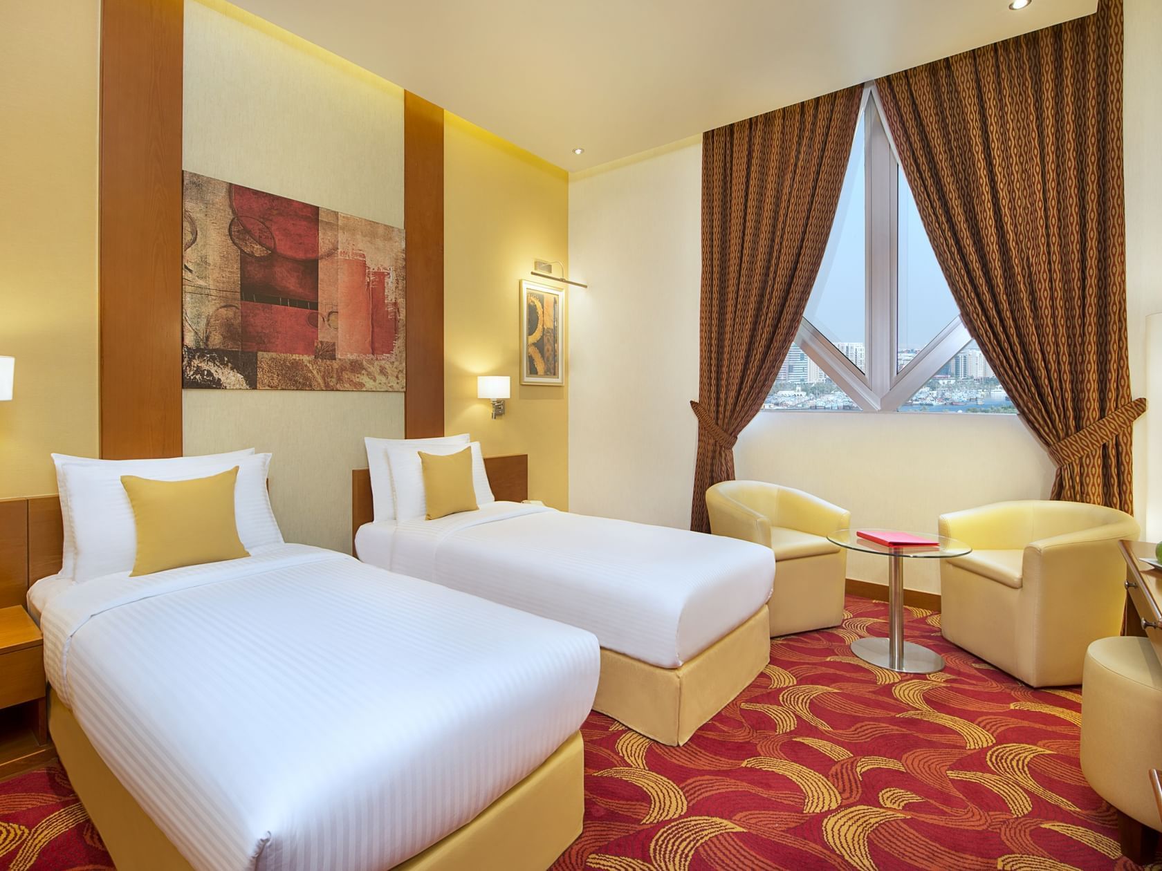 2 Beds & lounge area in Deluxe Room at City Seasons Hotels