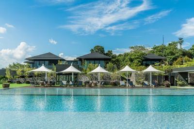 Lounges by the Infinity pool with a city view, Discovery Samal