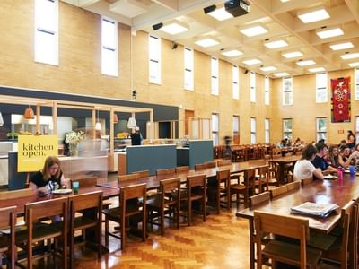 Students dining in a large hall at La Trobe University - Glenn College.