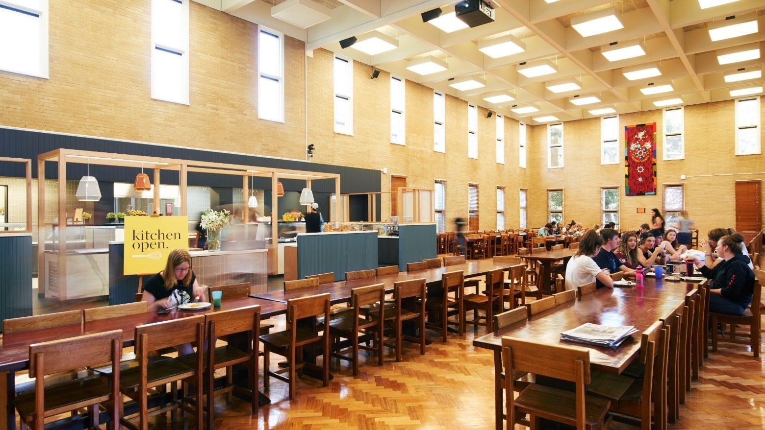 Students dining in a large hall at La Trobe University - Glenn College.
