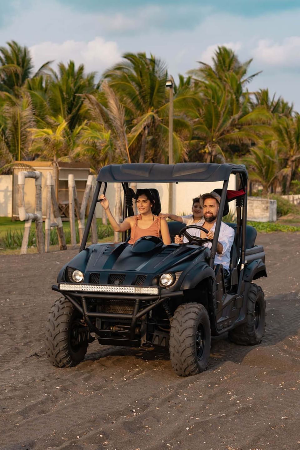 A family riding a buggy by the beach at La Mar Monterrico