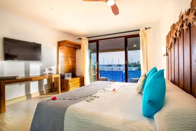 Bedroom arrangement in Cocoa Pod Suites at True Blue Bay Hotel