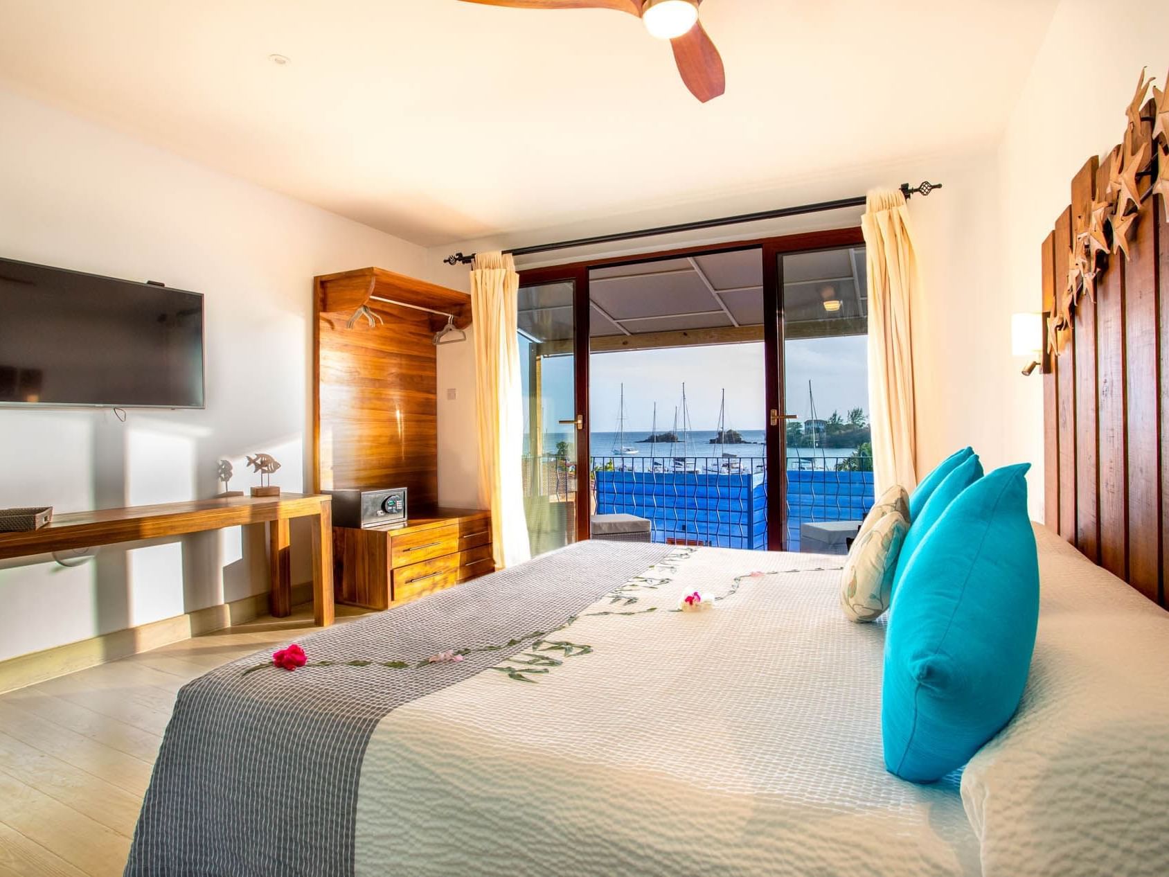 Bedroom arrangement in Cocoa Pod Suites at True Blue Bay Hotel