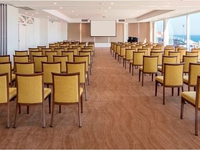Ballroom with chairs lined up in rows at Noah’S on the beach