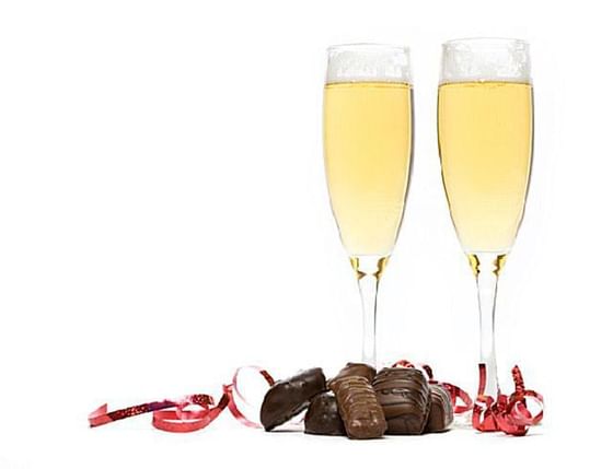 Two champagne glasses served with chocolates at Blackcomb Springs Suites