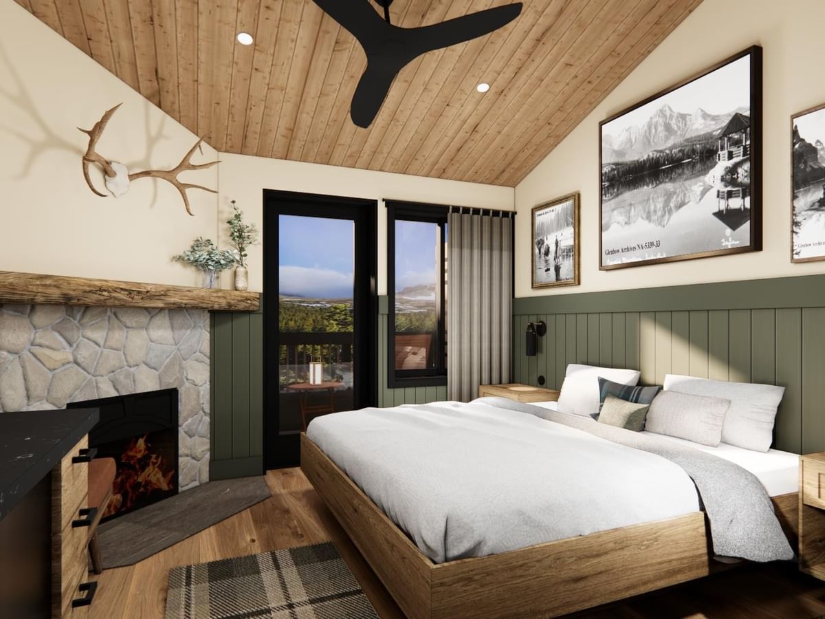 Suite with wood ceiling, fireplace, bed, and views.