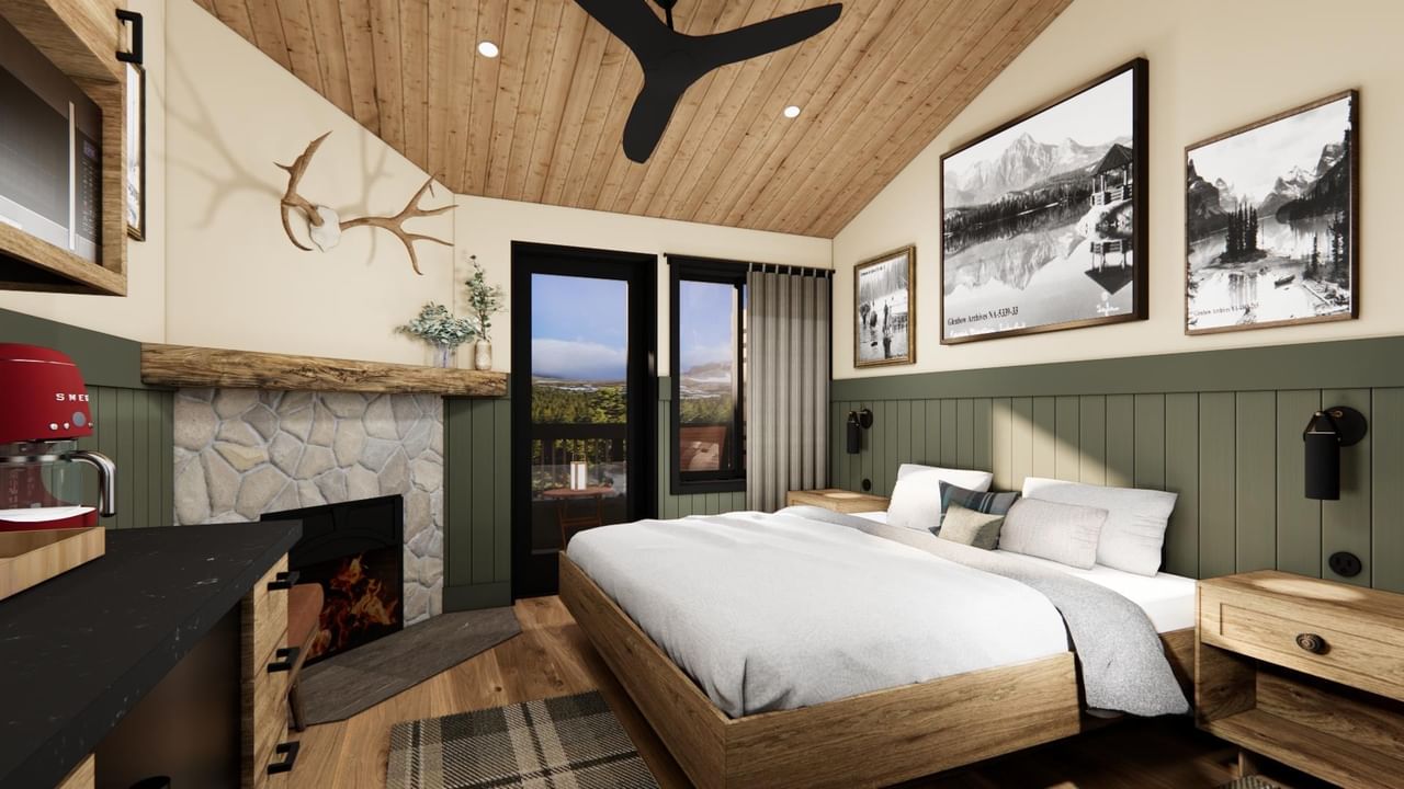 Suite with wood ceiling, fireplace, bed, and views.