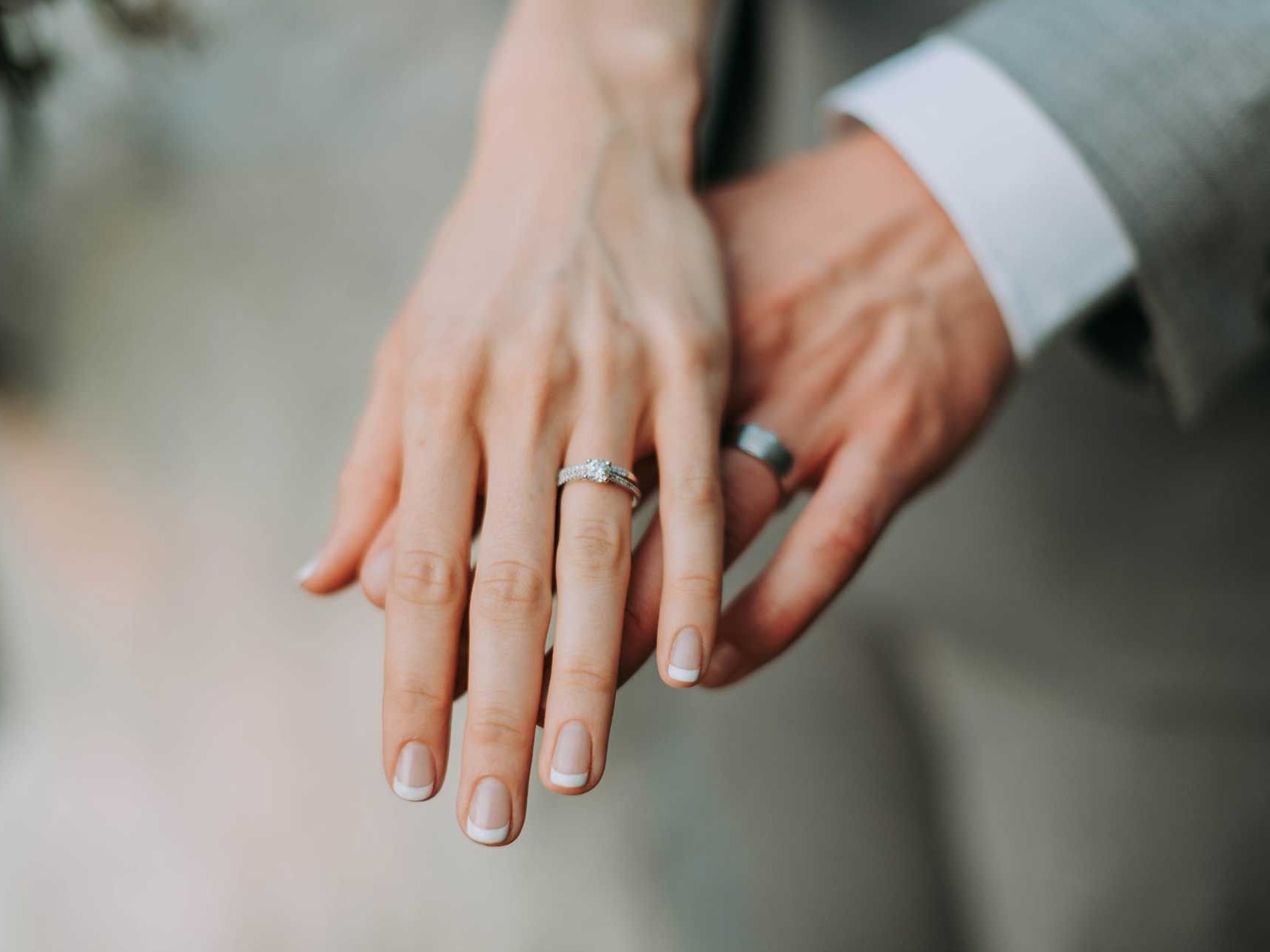 Close-up of a Newly wedded couple's hands at Discovery Samal