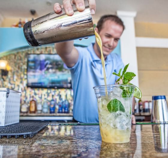 Bartender pouring cocktail