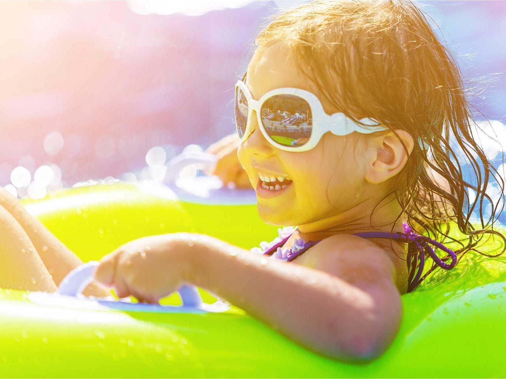 A girl enjoying on a swim ring at Artyzen Grand Lapa