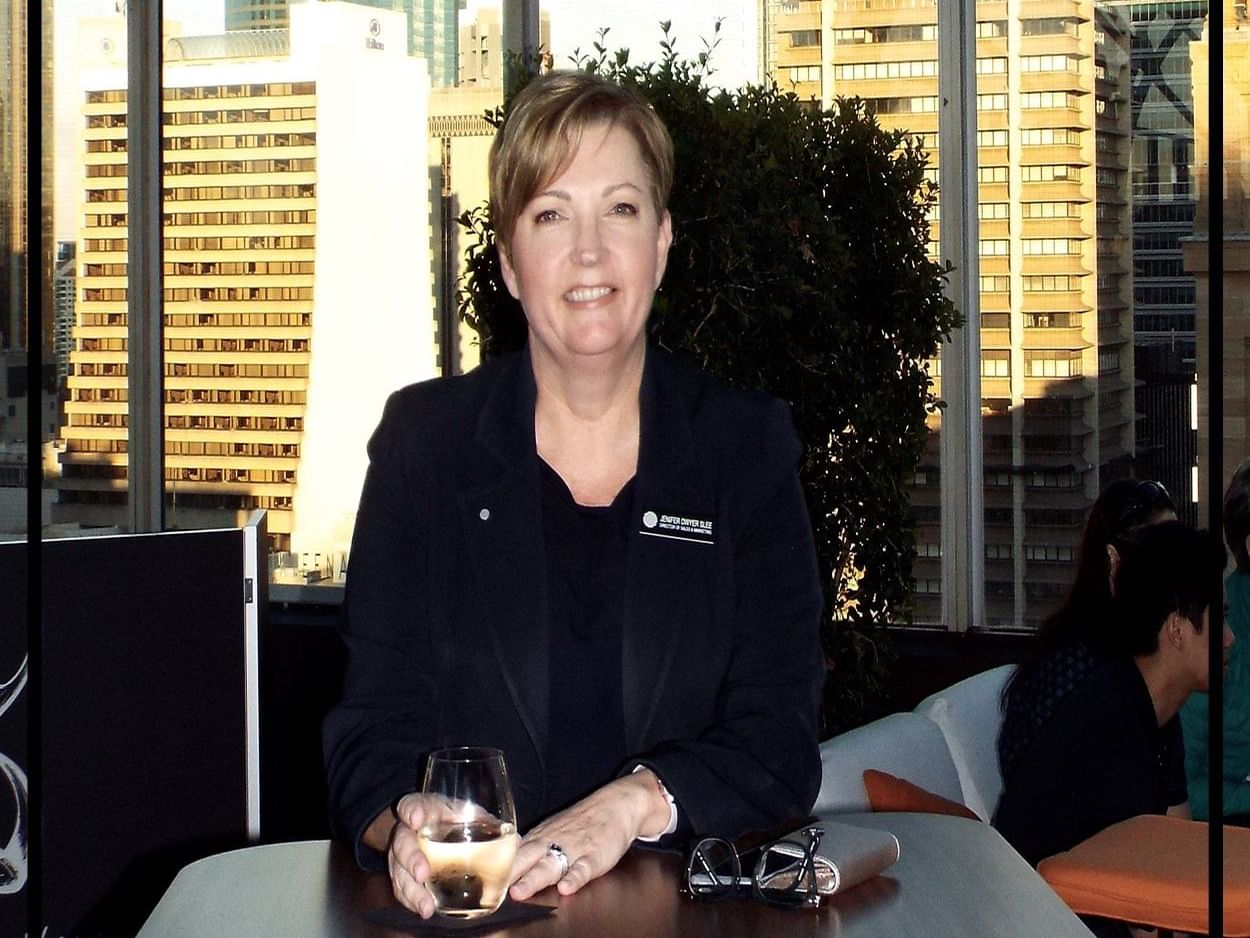 Lady holding glass of water at Pullman & Mercure Brisbane King George Square