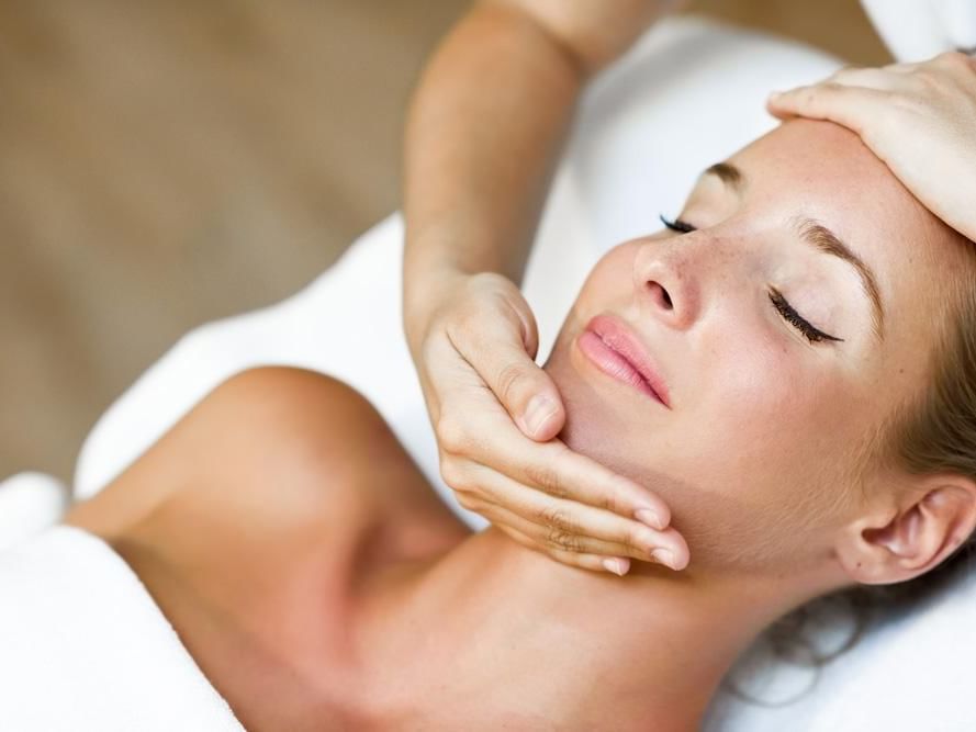 A woman having a facial massage in Sun Tree Spa at Temple Gardens Hotel & Spa