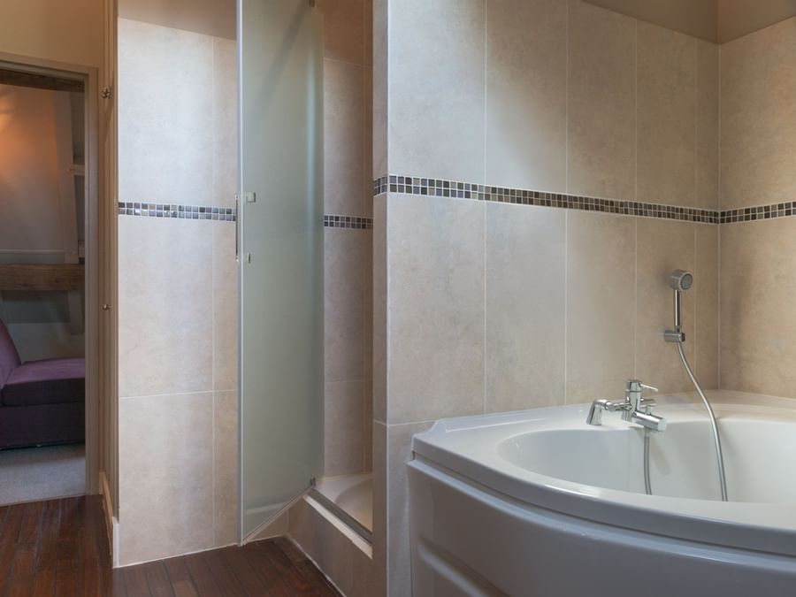 Bathroom with bathtub & folding bath shower screen