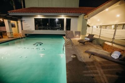 Sunbeds by the outdoor swimming pool at Araiza Hotel Calafia