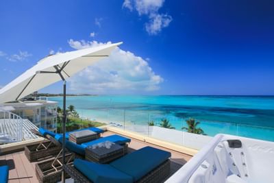 Ocean view from rooftop terrace with sun loungers in Penthouse at Windsong Resort On The Reef
