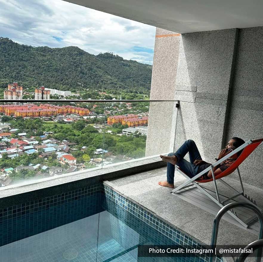 A man was chilling by the private pool at Lexis Suites Penang hotel - Lexis Suites Penang