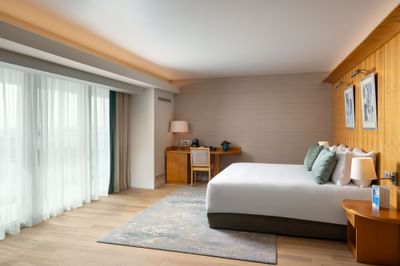 King Deluxe room with double bed, work desk and side table at Ana Hotels Europa