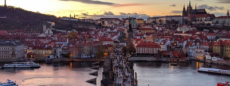 Sunset view over Charles Bridge with Prague Castle in the background near Almanac X Alcron Prague