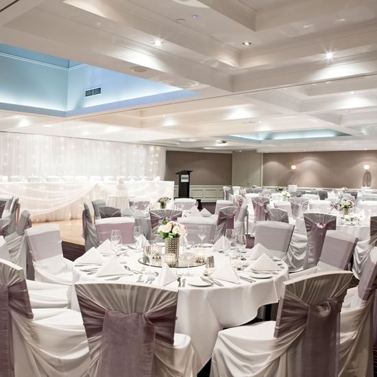 Banquet table arrangement with flower décor in a Ballroom at Pullman Sydney Hyde Park