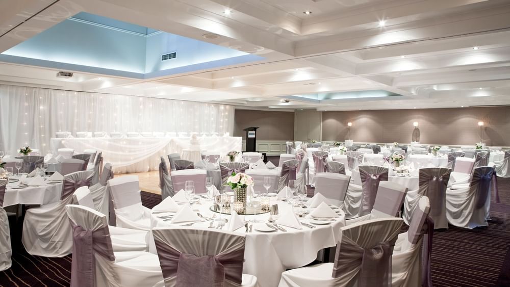 Banquet table arrangement with flower décor in a Ballroom at Pullman Sydney Hyde Park