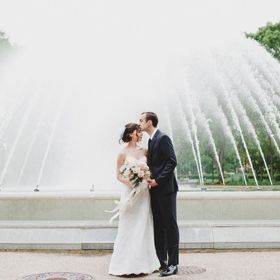 A wedding couple near the fountain at Matrix Hotel